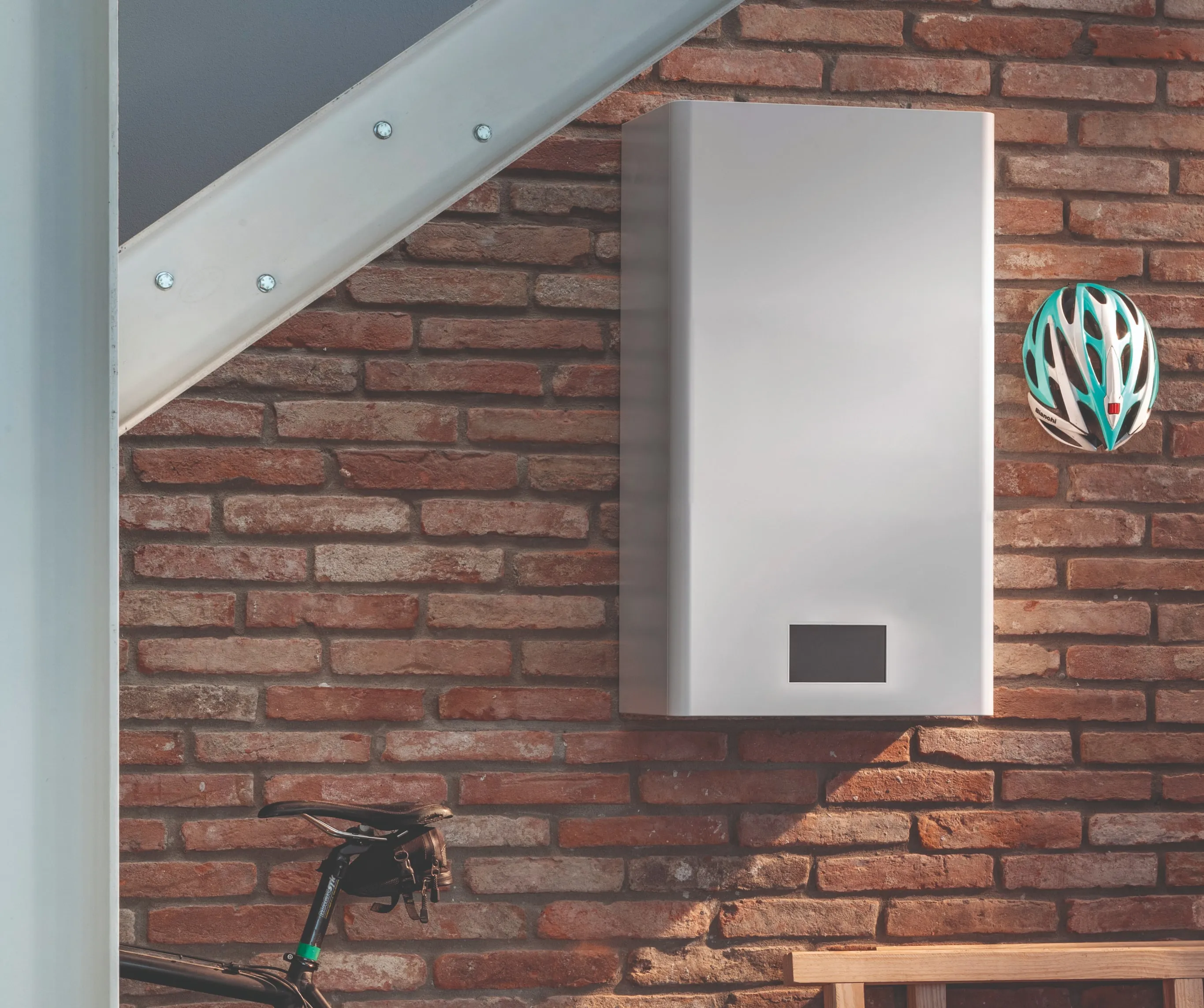 A STØNE unit mounted on a brick wall