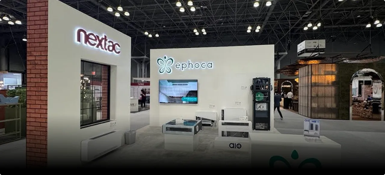 The Nextac and Ephoca booth at BDNY, units displayed on low plinths under the hall lighting