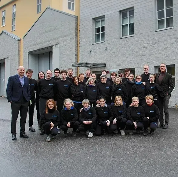 The grown INNOVA team gathered outside the factory