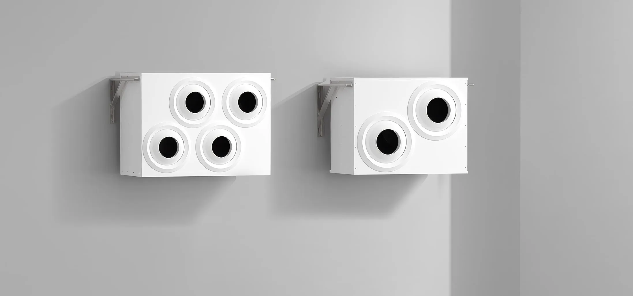 Two OKKI air jet units mounted high on an industrial wall